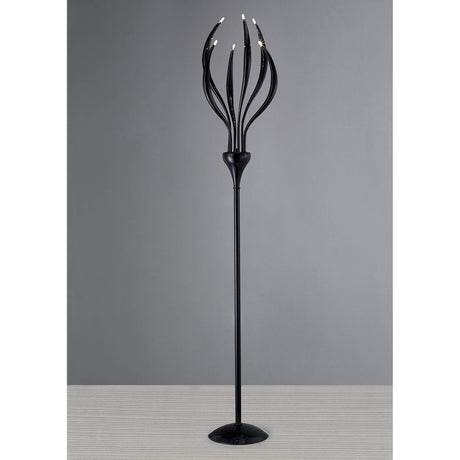 The Llamas 6 Light Floor Lamp - Black features a sculptural, modern design with six curved arms ending in small bulbs, providing ambient light and making a bold statement against a plain gray background.