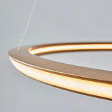 Close-up of Lighting No.1 Ashenhurst LED ring pendant in satin gold, showing the warm-lit circumference and slim metal profile against a pale background.