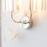 Close-up of the Calverdale Cut 2 Light Wall Light from Lighting No.1, showing the bright nickel backplate, curved arms and faceted cut glass shades.
