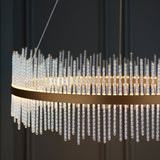 Rookhurst Rod Grand Pendant in gold by Lighting No.1, close-up of clear glass rods arranged around a circular brushed gold frame.