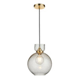 Yarnwell Bubble Pendant in clear seeded glass with a brass ceiling plate and black cord, shown lit with a filament E27 lamp on a white background.