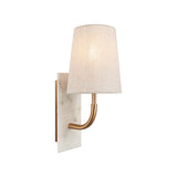 Fernhaven vintage curved brass arm wall light with tapered linen shade on a white marble backplate, shown against a plain white background.