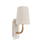 Fernhaven vintage curved arm wall light with tapered linen shade, brass arm, and white marble backplate by Lighting No.1 on a white background.