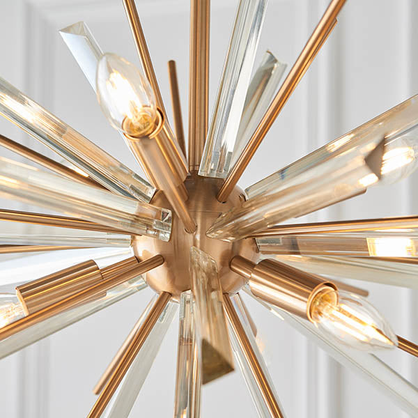 Close-up of the Lighting No.1 Selmoor Shards 6 Light Pendant showing antique brass plated arms radiating outward with clear glass shards and E14 candle bulbs.