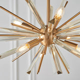 Close-up of the Lighting No.1 Selmoor Shards 6 light pendant with antique brass plated arms, clear glass shards and E14 candle bulbs in a starburst layout.
