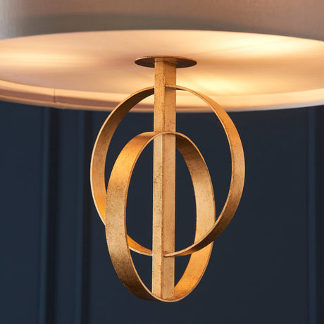 Close-up of the Lighting No.1 Sparrowmere Double Hoop pendant showing two interlocking gold leaf metal hoops beneath a mink fabric shade.