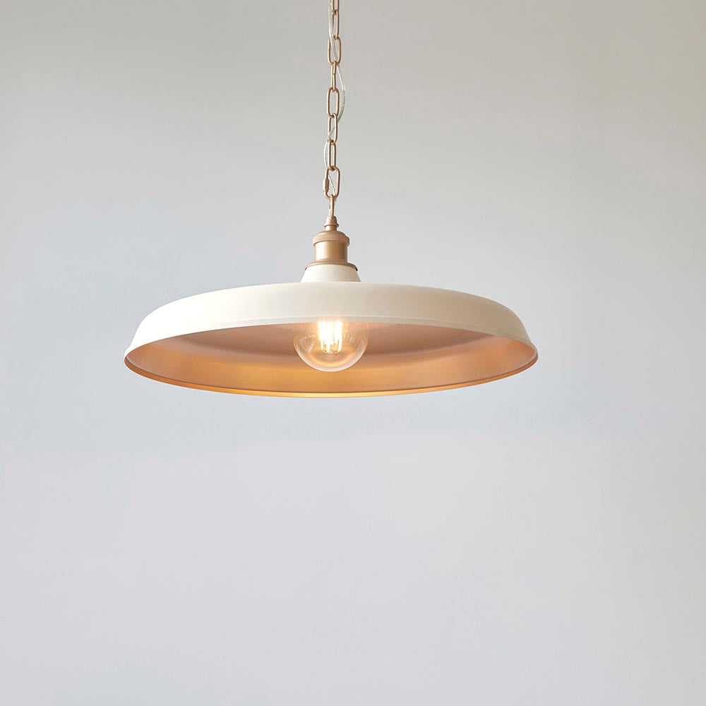 Lighting No.1 Denhollow Mid Century pendant light with a wide matt warm white dome, satin gold interior and chain suspension, lit E27 bulb, plain background.