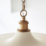 Close-up of Lighting No.1 Denhollow Mid Century pendant showing satin gold chain fitting, knurled lamp holder and matt warm white dome shade.