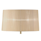 The Loewe 3 Light Floor Lamp features a brass base topped with a soft bronze, pleated cylindrical shade, shown against a white background.