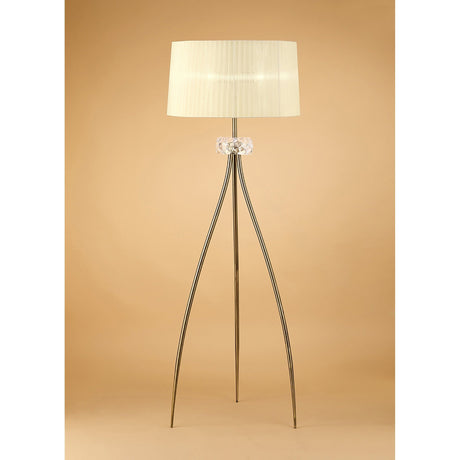 The Loewe 3 Light Floor Lamp features a brass finish, a cream drum shade, and a slender tripod base, shown against a plain beige background.