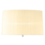A close-up of the Loewe 3 Light Floor Lamp’s cream cylindrical shade with subtle vertical lines, highlighting its sculptural chrome design, set against a white background.
