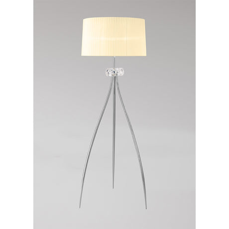 The Loewe 3 Light Floor Lamp features a cream cylindrical shade, a clear glass accent near the top, and three slender chrome legs, shown against a plain light gray background.