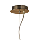 Close-up of the Mantra Loewe pendant's antique brass ceiling canopy with suspension cable and wiring, shown against a plain white background.