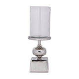 Longnah Candle Holder in polished silver aluminium with a square base, bulb-shaped stem, and round dish holding a tall clear glass cylinder, on a plain white background.