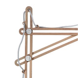 Close-up of the Looker 1 Light Wood Floor Lamp in matt white, showing Scandinavian-inspired light wood rods, white cylindrical connectors, and cords threaded through cutouts for a minimalist, geometric adjustable-arm design.