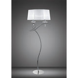 The Louise 2 Light Crystal Floor Lamp features a chrome finish, white fabric drum shade, round base, and decorative curved stand. Its artistic design and crystal accents provide ambient lighting against a plain gray background.