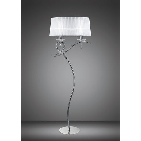 The Louise 2 Light Crystal Floor Lamp features a chrome finish, white fabric drum shade, round base, and decorative curved stand. Its artistic design and crystal accents provide ambient lighting against a plain gray background.