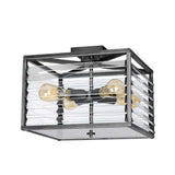 The Louvre 4 Light Flush in a sleek graphite finish features a square, modern design with clear glass panels and four exposed bulbs that emit a warm glow. This fixture strikes the perfect balance between industrial and minimalist styles, making it an ideal choice for those seeking industrial lighting with a stylish edge.