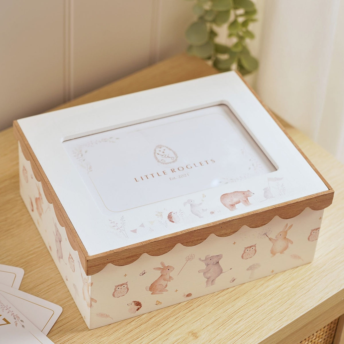 Cream wooden photo keepsake box, 6 x 4in, with scalloped natural wood lid edge, photo window, and watercolour-style animal print sides, shown on a wooden surface.