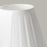 Close-up of the Clip Shades Pleated White Candle Shade, featuring a classic tapered design and crafted from pleated polycotton fabric, set against a plain gray background. A perfect addition to your lighting fixtures collection.