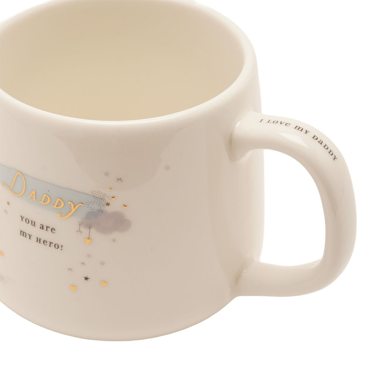 Close-up of a cream stoneware mug with "Daddy you are my hero" in gold script, pastel cloud and heart details, and "I love my Daddy" printed on the handle.