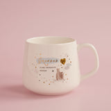 Cream stoneware mug with "Grandad is my favourite person" in gold script, featuring two bears beside a gold heart balloon and stars, shown on a pink background.