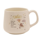 Cream stoneware mug with gold "Nan" lettering, a hug quote, and an illustrated scene of two bears, moon, clouds, and stars, shown on a white background.