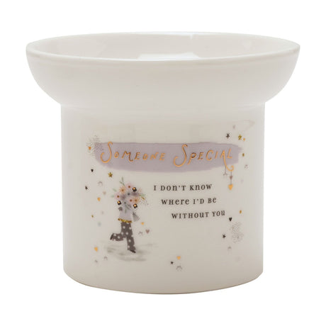 Round white ceramic wax melt burner with shallow dish, featuring "Someone Special" in gold on a lilac brushstroke and a floral bouquet figure design, shown on a plain white background.