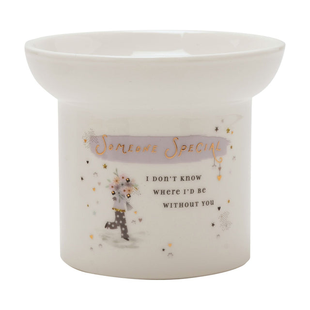 Round white ceramic wax melt burner with shallow dish, featuring "Someone Special" in gold on a lilac brushstroke and a floral bouquet figure design, shown on a plain white background.