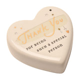 Cream ceramic heart keepsake token with glossy glaze, "Thank You" in gold script and "for being such a special person" beneath, decorated with tiny gold stars and hearts on a white background.