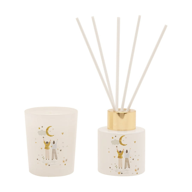 Birthday Moon Mini Glass Candle and Reed Diffuser set in white, with frosted glass candle holder, round diffuser bottle with gold cap, white reeds, and a printed moon design.
