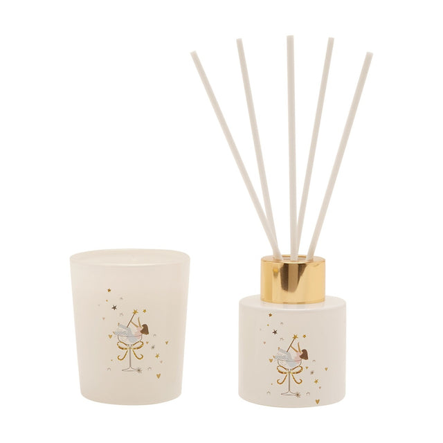 Sparkle Fairy mini glass reed diffuser with gold cap and white reeds, paired with a matching white glass candle, both featuring a fairy-in-coupe design with gold stars.