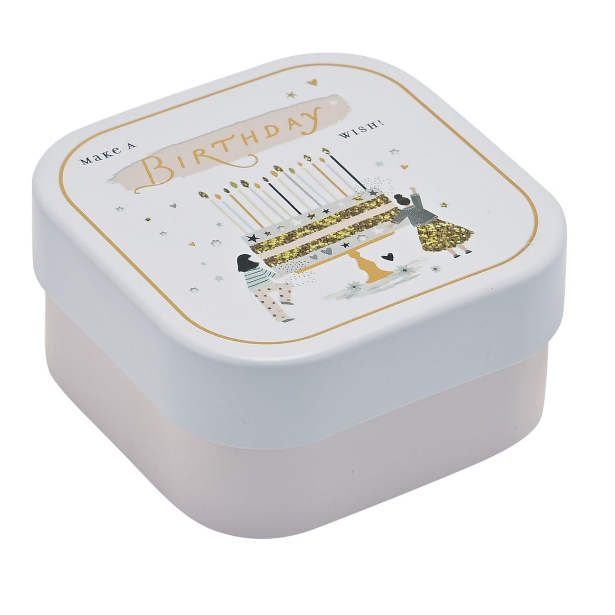 Square tin scented candle with white lid featuring a gold-lined "Make a Birthday Wish" design, layered cake, candles, stars and hearts, set on a pale pink base, plain white background.