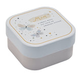 Square lidded tin candle with white lid featuring gold "Mum" script, pastel butterflies and star details, set on a blush pink base against a plain white background.