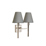 The Lucerne 2 Light Wall Light - Brushed Nickel with Grey Shade boasts sleek metallic arms in a brushed nickel finish and two elegant gray cone-shaped lampshades, all expertly mounted on a square base, making it an ideal addition to any modern interior.