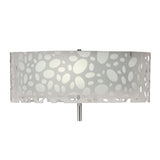 The Lupin 4 Light Floor Lamp in gloss white and polished chrome features a sculptural design with a cylindrical shade and abstract oval cutouts, providing soft ambient lighting as light filters through its unique openings.