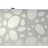 The Lupin 4 Light Floor Lamp features a gloss white shade with abstract oval and circular cutouts, allowing ambient light to shine through; its sculptural design stands out with polished chrome accents.