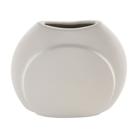 Lyaglan ceramic vase in matt beige, with a flattened, rounded pebble-like body, off-centre raised disc detail, and a narrow oval mouth, shown on a plain white background.