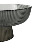 Close-up of the Mambrui Glass Decorative Bowl 20cm in grey, showing fine vertical ribbing on the flared pedestal foot and bowl exterior against a plain white background.