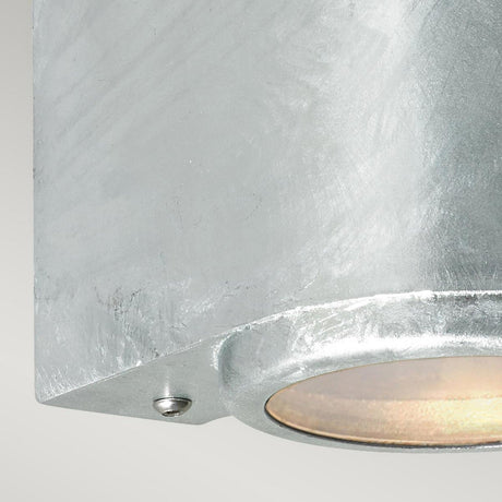 Close-up of the Mandal Outdoor LED Down Wall Light in silver, showcasing its energy-efficient LED technology. The matte finish accents the bottom edge and a small screw, highlighting the smooth texture and detailing of its galvanized steel surface.