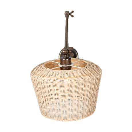 Manila Large Rattan Wall Light with a woven rattan drum shade on a jointed brass arm with wing nuts, mounted to a round wall plate, shown on a white background.