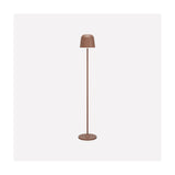 Mannera-L LED floor lamp in an auburn finish, with a bell-shaped head, white plastic shade rim, slim stem and round disc base, on a plain white background.