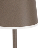 Close-up of the Mannera-L LED floor lamp's bell-shaped shade in a speckled auburn finish with a white rim edge, shown on its slim stem against a plain white background.