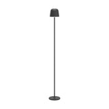 Mannera-L LED floor lamp in black, featuring a slim stem, domed head, and round disc base, shown against a plain white background.