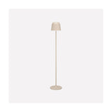 Mannera-L LED floor lamp in sand, slim stem with bell-shaped shade on a round flat base, set against a plain light background.