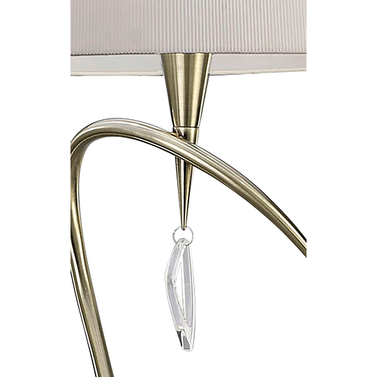 Close-up of the Mara 4 Light Floor Lamp in antique brass, featuring a curved arm, ivory white pleated shade, and an elegant clear crystal pendant hanging from the center.