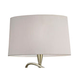 A close-up of the Mara 4 Light Floor Lamp, featuring an antique brass base and an ivory white pleated shade, set against a white background.