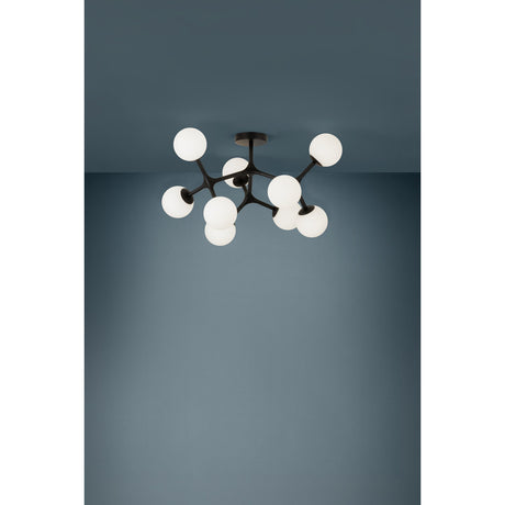 Maragall 9 Light Ceiling Light in black steel with branching arms and round matt opal glass globes, shown fitted to a grey ceiling.