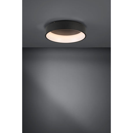 Marghera 2 LED flush ceiling light, 59.5cm round black steel drum with white plastic diffuser, mounted on a grey ceiling and casting warm light downward.