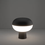 Marini Smart Colour Changing LED Table Lamp in matt black, mushroom-shaped with domed top and glowing white band on a slim tapered base, shown lit against a plain grey background.